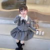 The 2023 autumn new collection features a three-piece Korean-style bear cardigan, pleated skirt and shirt for girls, middle-aged and young children Application Scenario